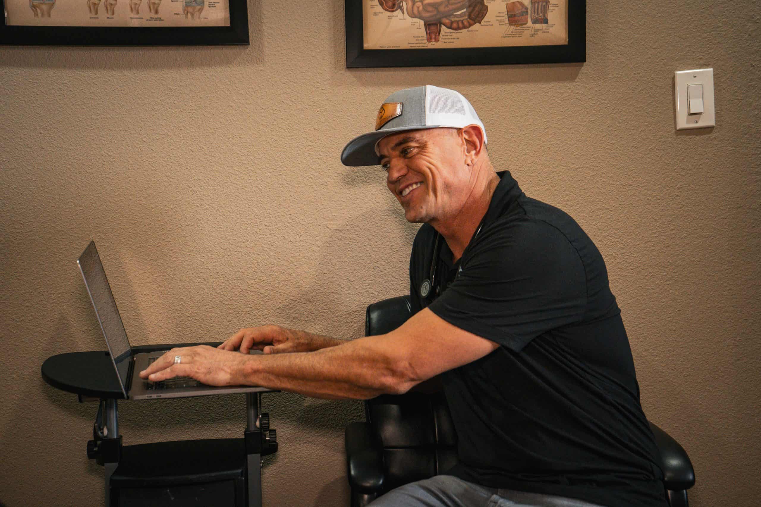 Jim May, FNP-C, at his desk at Alpha Medical